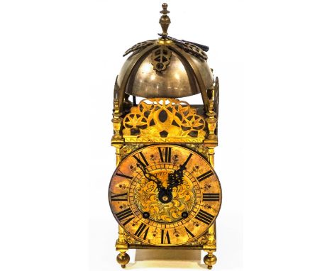 A Victorian brass lantern clock, with engraved dial signed Edward & Sons, Glasgow, the eight day movement striking on a bell,