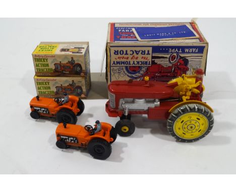 A Tricky Tommy battery operated tin plate and plastic tractor in original box, and two Tricky Action tractors in boxes