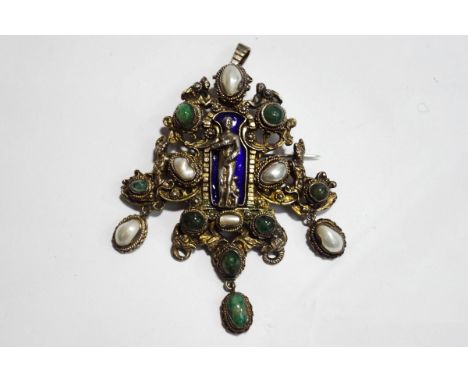 An Austro Hungarian emerald, blister pearl and enamel pendant brooch, to the centre of the mount is a female figure shielding