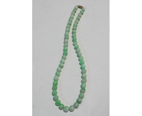 A Jade bead necklace, the 53 round beads slightly graduated, approximately 11mm to 8.3mm, 52cm wide