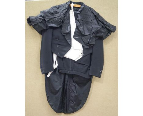 A vintage tailcoat and trousers by M & J.M. Simons of Cardiff, and a Victorian shawl