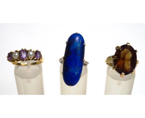 A five stone amethyst and cultured pearl ring, unmarked, finger sze O, 4.7 g gross; a lapis lazuli ring; and a costume jewell