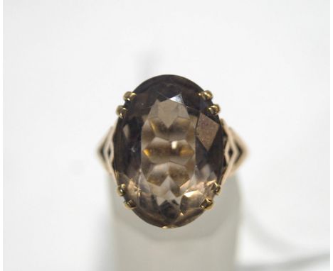 A single stone smokey quartz dress ring, stamped '9ct', 6.7 g gross