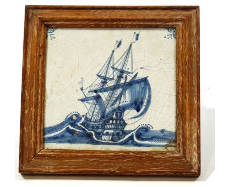 A Dutch Delft tile painted in blue with a sailing galleon, 12cm x 11.5cm, framed