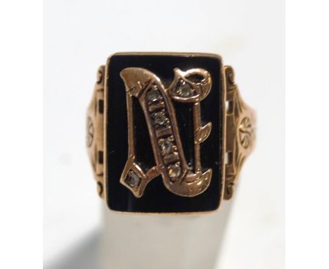 An gold initial ring, the diamond set letter 'N' to an onyx ground, finger size U, 6 g gross