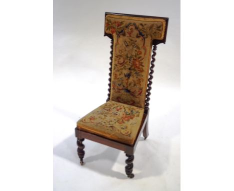 A Victorian rosewood pre-dieu chair, with tapestry upholstery, barley twist supports and turned legs