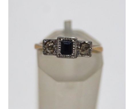 A sapphire and diamond three stone ring, stamped '9ct' and 'Plat', finger size K, 1.9 g gross