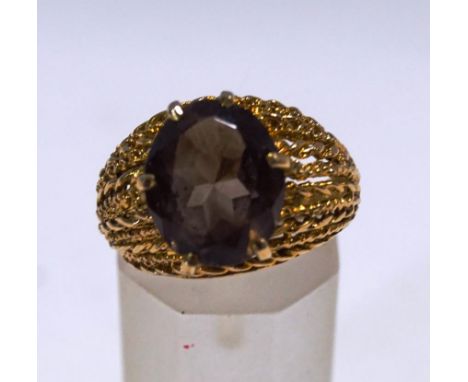 A smokey quartz single stone dress ring, stamped '9ct', finger size N, 4.2 g gross