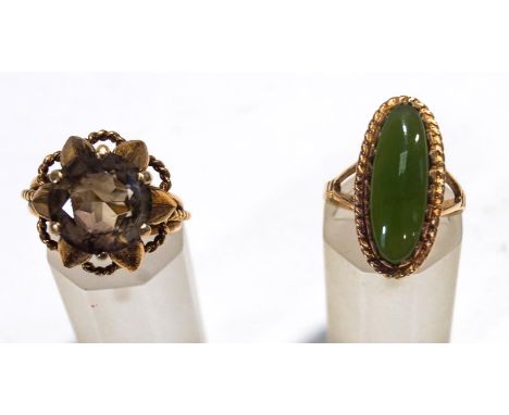 A single stone jade ring, stamped '9ct', finger size L; with a single stone smokey quartz 9 carat gold dress ring, finger siz