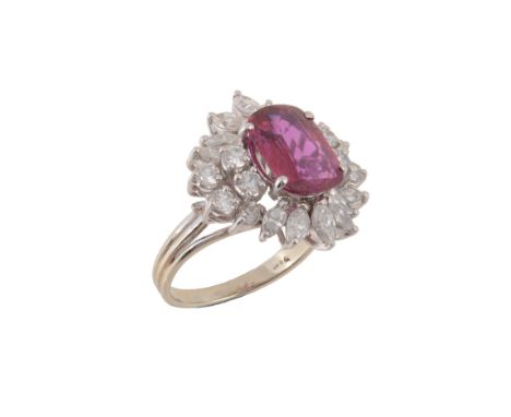 A ruby and diamond cluster ring, the oval cut ruby estimated to weigh 1.94 carats, within a marquise and brilliant cut diamo