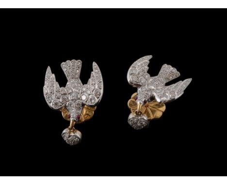  A pair of diamond and ruby Saint Espirt ear studs, the pave set diamond doves with cabochon ruby eyes, suspending a diamond 