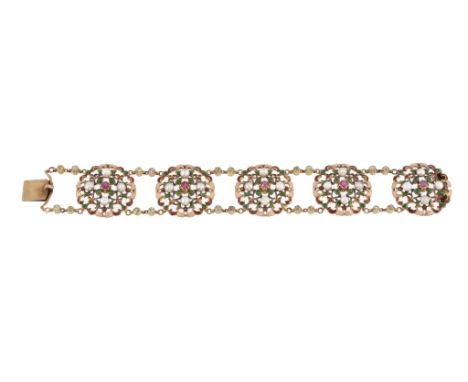  A late Victorian gold, enamel and gem set bracelet by Carlo and Arthur Giuliano, circa 1900, the pierced circular panels eac