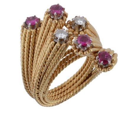  A ruby and diamond cross over ring, set with brilliant cut diamonds and circular shaped rubies on a coiled ropewist shank, f