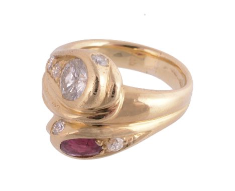  A ruby and diamond double snake ring, the snakes with diamond set eyes, one with a ruby and diamond head, the other with a d