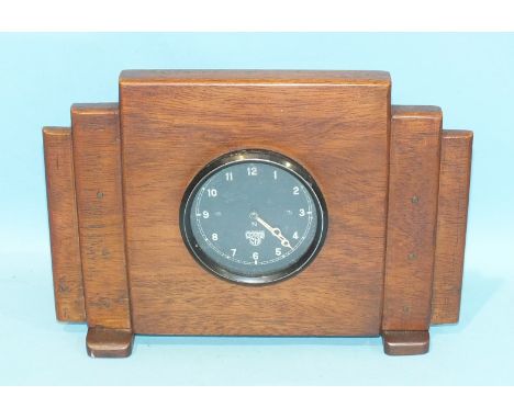 A Smiths car clock set into a wooden case.