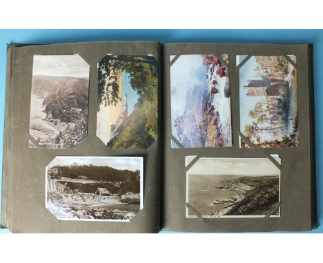 An album of 245 postcards of Devon, including RPs, oilettes, A R Quinton, etc.