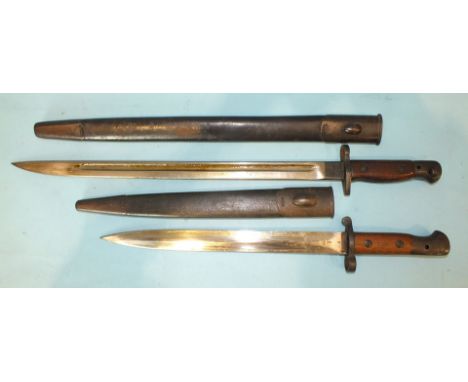 A bayonet stamped 'Sanderson', with wood grips and 43cm single fullered blade, in leather and metal-mounted scabbard and anot