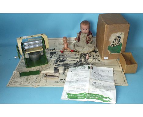 A Knight's Head Model Mangle with instructions, spanner and 'Exploded Diagram', boxed and two composition dolls, (3).