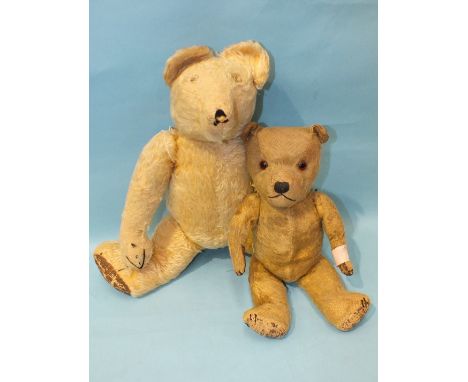 A 1940's Chiltern Hugmee teddy with golden mohair plush, glass eyes, stitched nose, jointed body and Rexine-covered paws, 38c