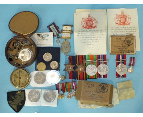 A family group of WWII medals: 1939-45 and Burma Stars, Defence and 1939-45 War Medals, with miniatures, envelopes and box of