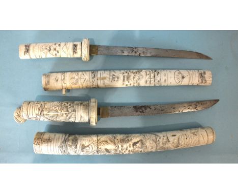 An early-20th century carved bone Japanese tanto dagger with 22'' single-edge blade, the sectional handle and scabbard carved