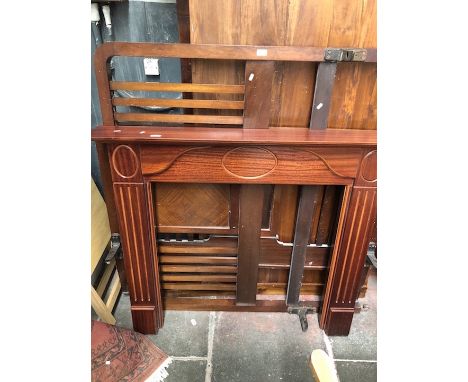 A mahogany fire surround 