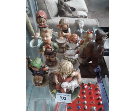 9 Hummel Goebel figures including a wooden one 