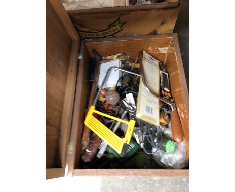 A small wooden box of tools 