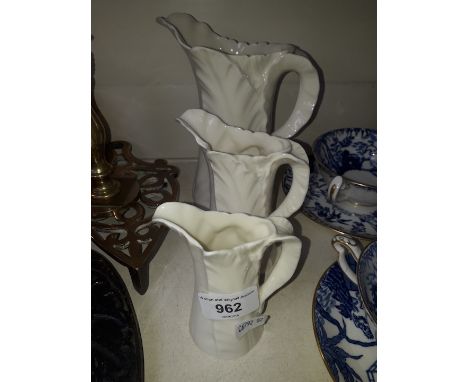 3 Royal Worcester graduated jugs in cabbage pattern 