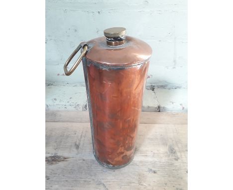 A copper flask of cylindrical form with brass fittings, length 28cm. 