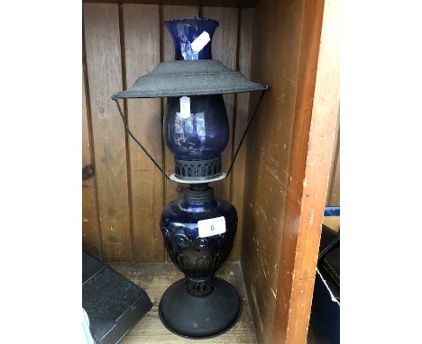 A metal and cobalt glass lamp with shade 