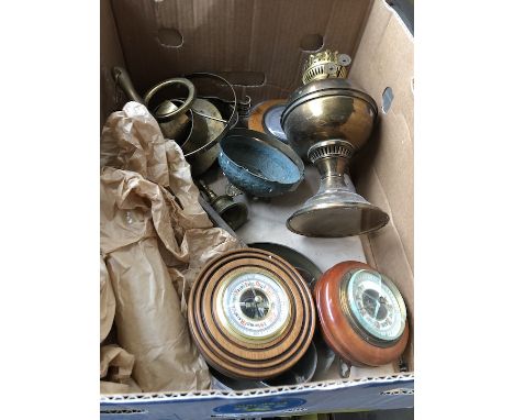 A box of misc brassware to include circular barometers, a metronome, a brass parafin lamp, etc 