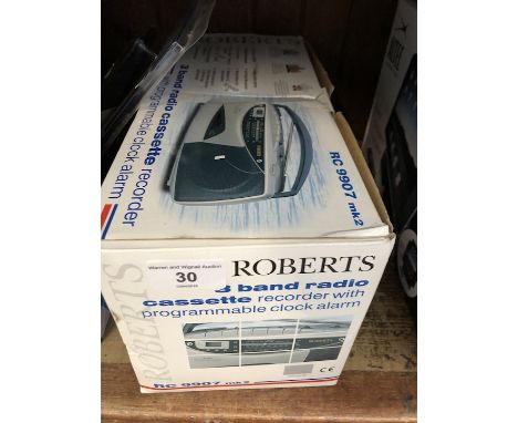 A boxed Roberts 3 band radio cassette with clock alarm 