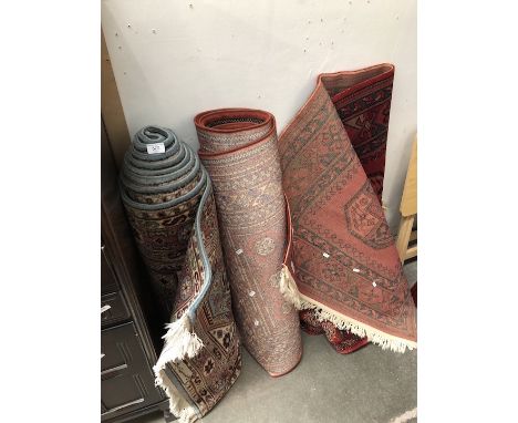 2 red rugs and a runner/stair carpet 