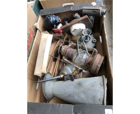 A box of mixed items including old cast novelty money bank, oil can, storm lamp, blow torch etc 