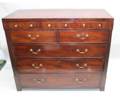 A 19TH CENTURY MAHOGANY MULTI-DRAWER CHEST having plain crossbanded caddy top, over three slender drawers, with two further i