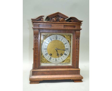 AN EARLY 20TH CENTURY PROBABLE GERMAN MAHOGANY CASED MANTEL CLOCK having architectural pediment, with twin carved pilaster si