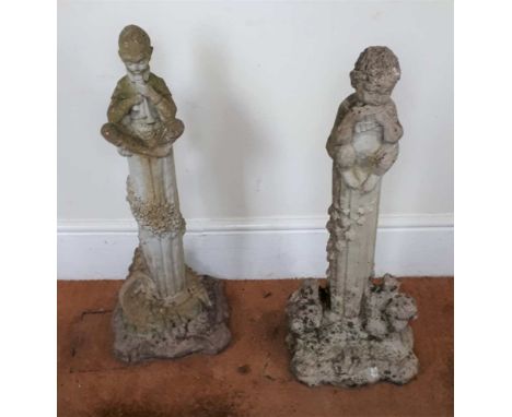 A PAIR OF CAST CONCRETE GARDEN FIGURINES, one a pipe playing pixie upon a column, with cornucopia horn of plenty below, beari