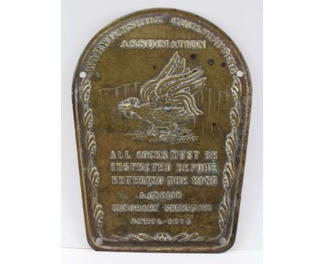 AN EMBOSSED BRASS COCK FIGHTING PLAQUE, embossed with fighting cock image and text 'Warwickshire Cockfighting Association, Al