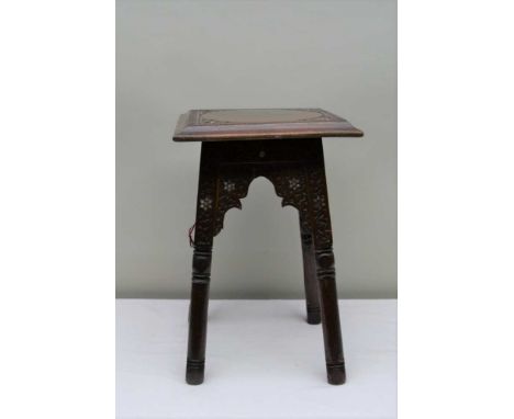 AN EARLY 20TH CENTURY MOORISH CARVED WOOD OCCASIONAL TABLE, chip carved decoration, inlaid mother-of-pearl, square top, raise