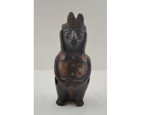 A PRE-COLUMBIAN INCA TERRACOTTA VESSEL in the form of a Shaman, painted in a polychrome finish of red, black, and cream, moul
