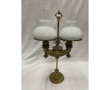 A VINTAGE BRASS TWIN OIL LAMP WITH GLASS FUNNELS AND MILK GLASS SHADES HEIGHT 66CM 