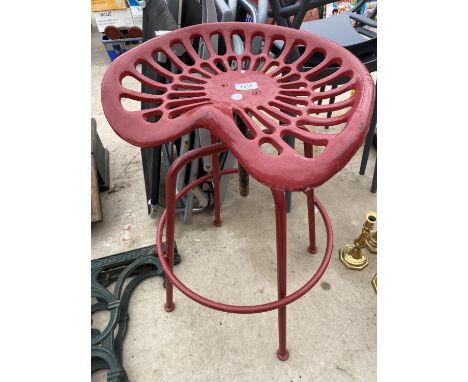 A VINTAGE TRACTOR/IMPLIMENT SEAT CONVERTED INTO AN ADJUSTABLE STOOL 