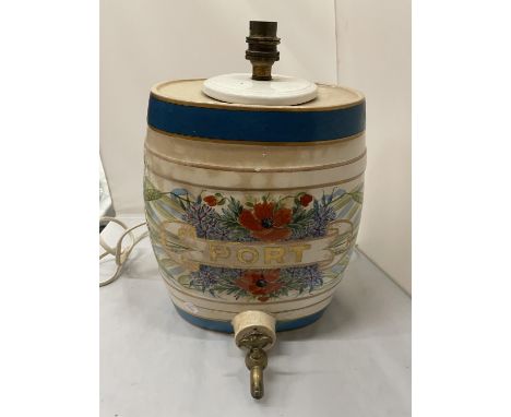 A LARGE PORT BARREL WITH A TAP COVERTED TO A LAMP 