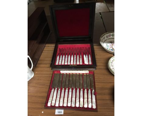 A SET OF MOTHER OF PEARL HANDLED KNIVES AND FORKS IN A MAHOGANY BRASS INLAID BOX 