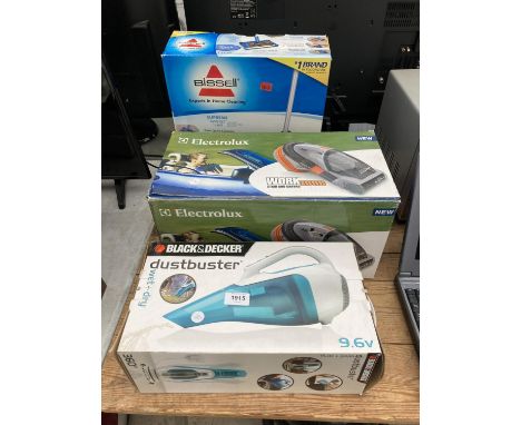 A BLACK AND DECKER DUST BUSTER, AN ELECTROLUX CARVAC AND A BISSELL SWEEP TURBO 
