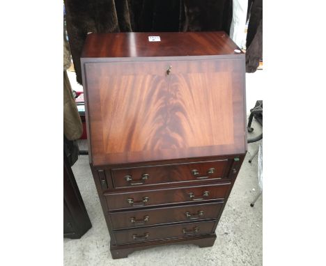A REPRODUCTION MAHOGANY BUREAU ON BRACKET FEET, 20" WIDE 