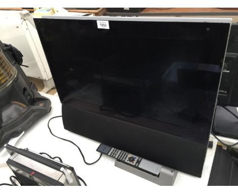 A BANG AND OLUFSEN BEOVISION 6 WITH WALL BRACKET AND REMOTE CONTROL (UNLOCK CODE AVAILABLE) 