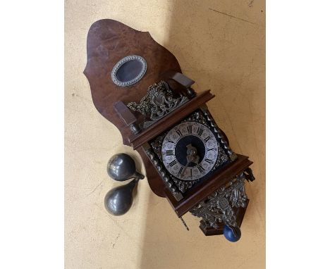 A VINTAGE STYLE WALL CLOCK INCLUDING THE CHAINS AND WEIGHTS WITH A ROMAN NUMERAL DIAL AND A FIGURE OF ATLAS TO THE TOP, HEIGH
