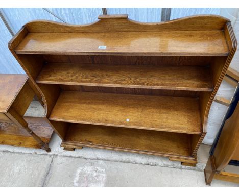 A GEORGE III STYLE LIGHT OAK WATERFALL BOOKCASE, ON OGEE FEET, 42.5" WIDE 